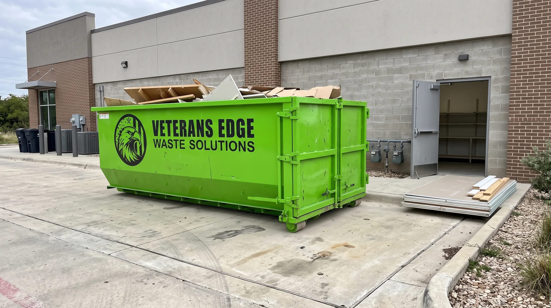 Veterans Edge dumpster outside a retail suite remodel